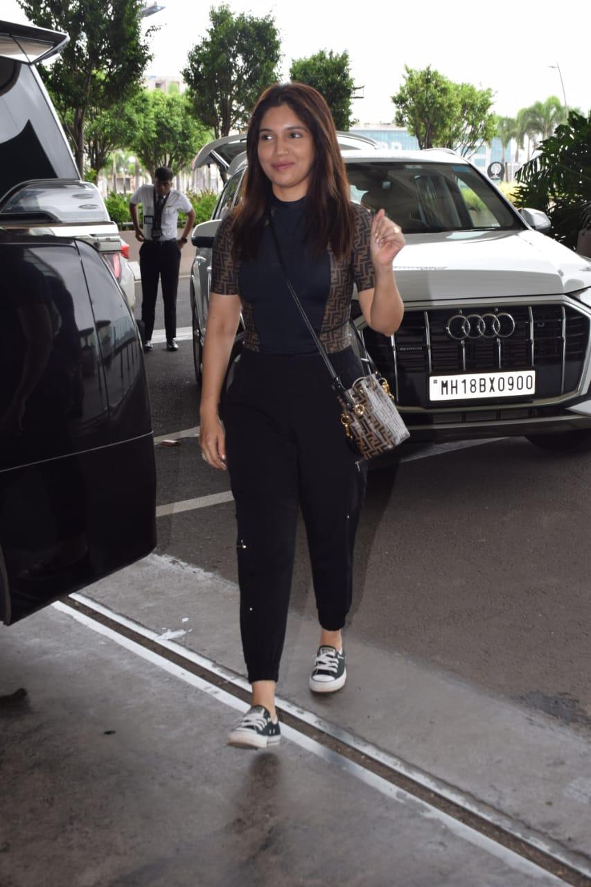 She looked effortlessly glam in a casual combo of a fitting top and joggers. she waved graciously for the paparazzi before getting on with her day